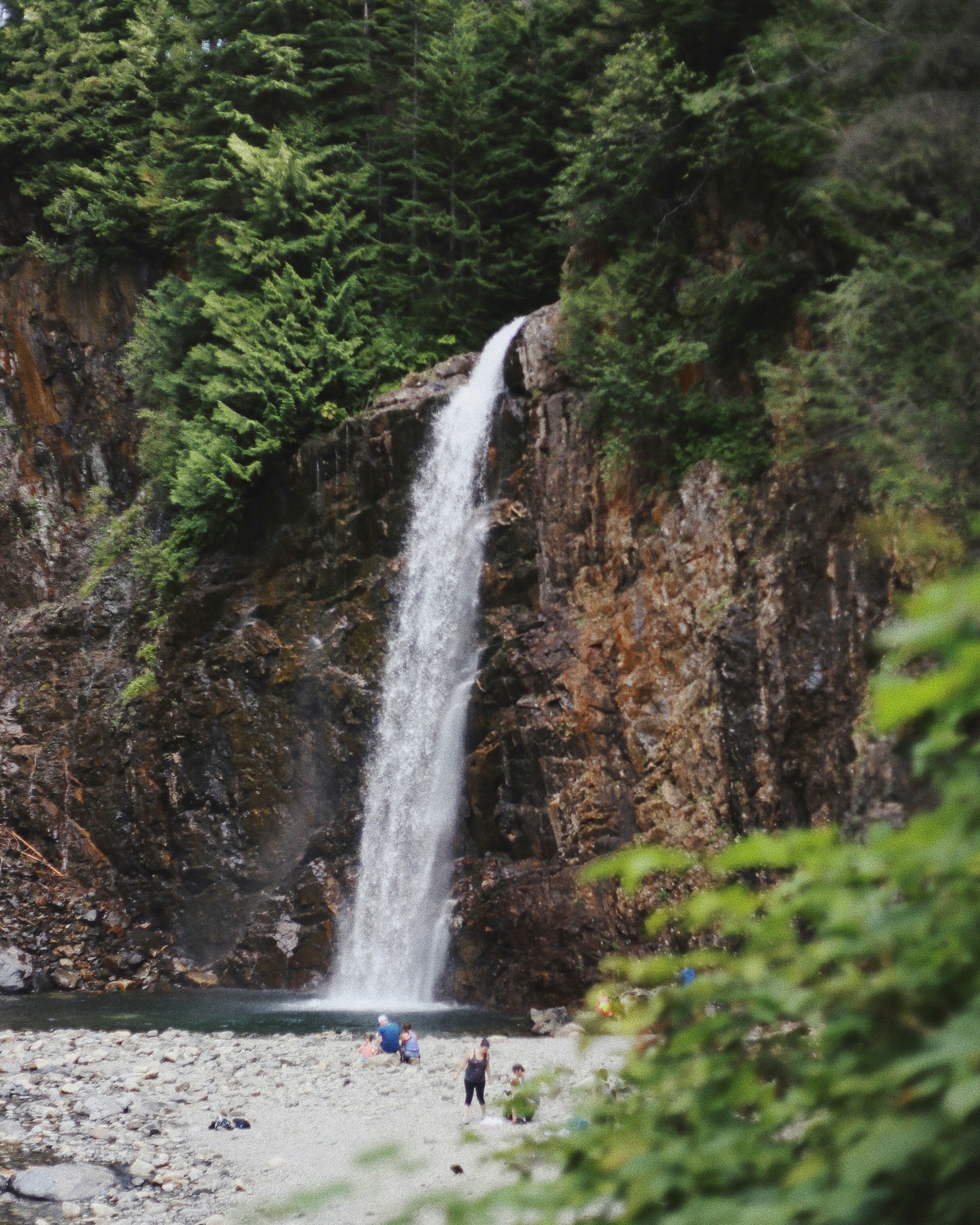 people near waterfall